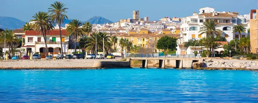 Aerial view of Jávea coastline showing the Mediterranean Sea, sandy beaches and traditional whitewashed buildings