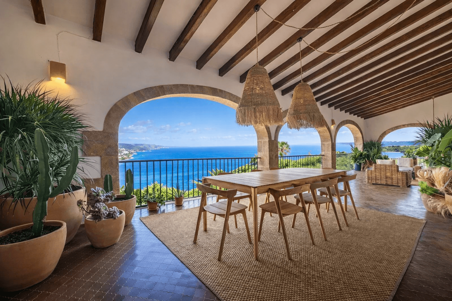 Covered terrace with Mediterranean sea view overlooking Jávea coastline from a luxury holiday villa
